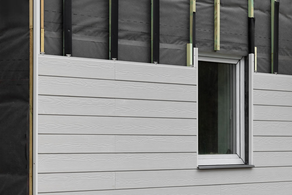 Grey siding being installed on a house in Dayton, OH